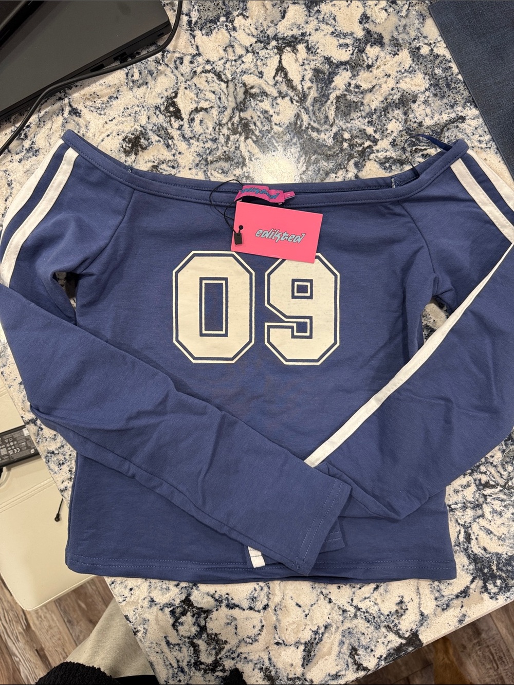 Edikted Blue Long Sleeve Off-Shoulder Tee with White Stripes and '09' Graphic